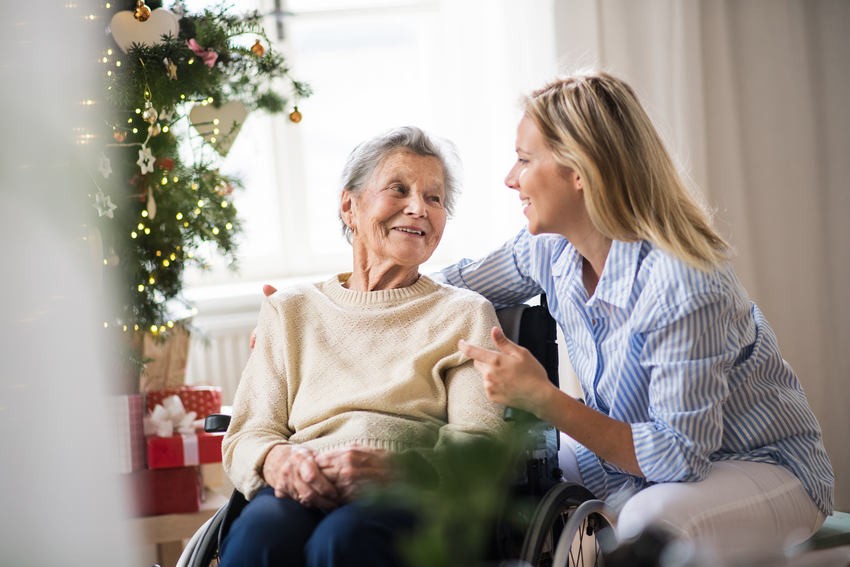 elderly woman is happy after receiving Christmas Presents 
