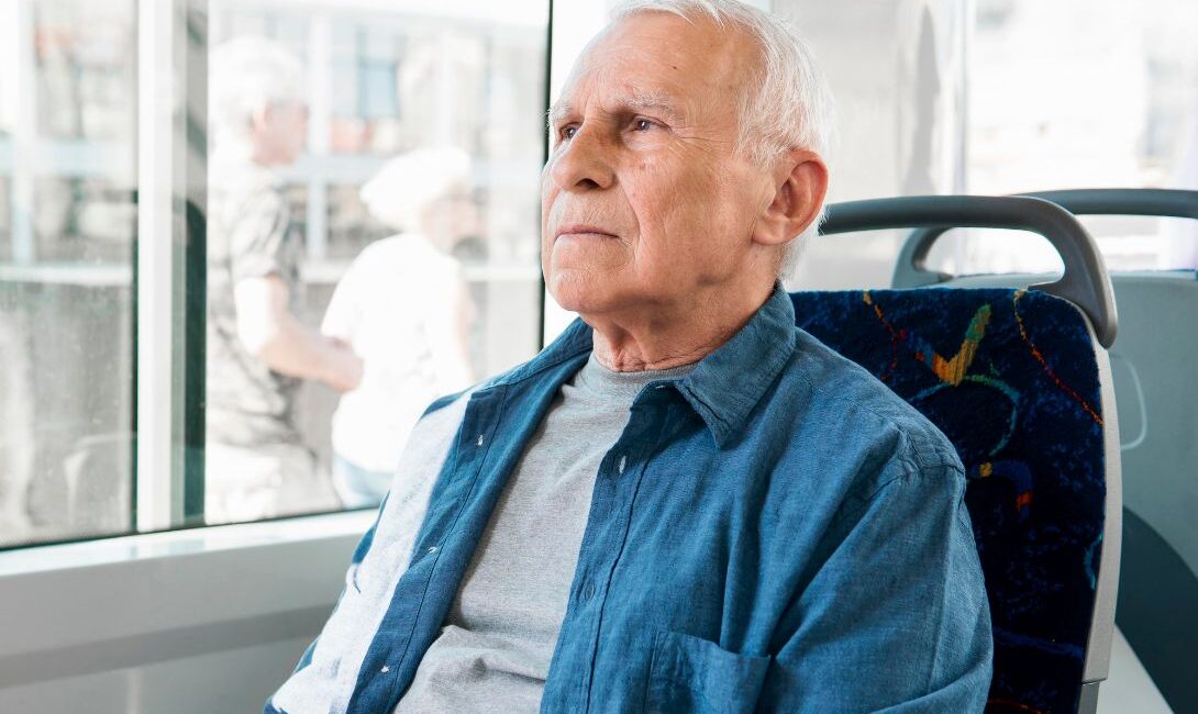 Senior man using public transportation service