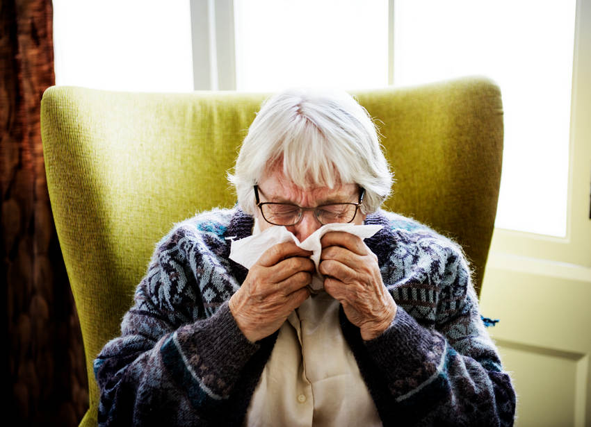 Senior Woman Sneezing