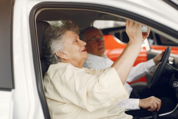 senior woman driven by caregiver