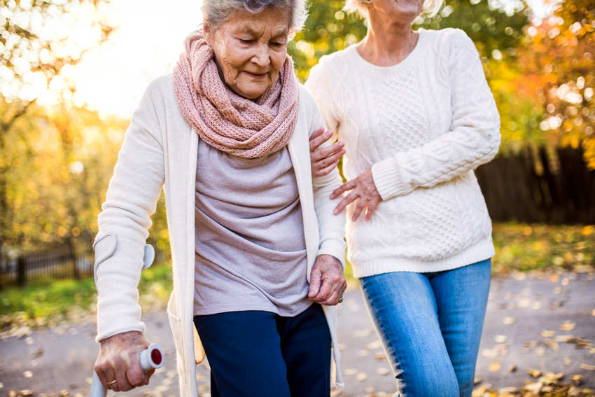 elderly woman walking after a fall