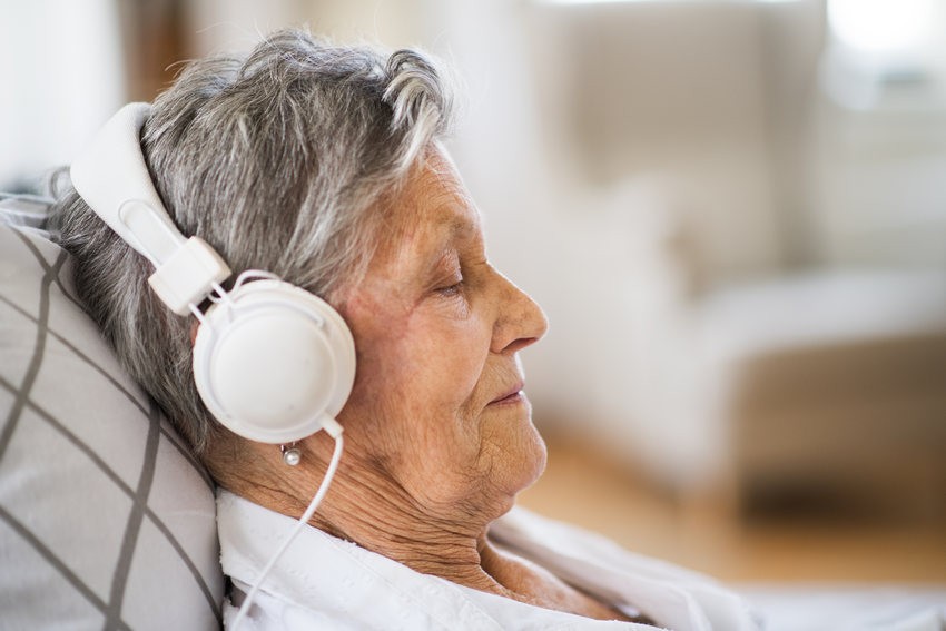 old woman with headphones Healing Dementia With Music Therapy