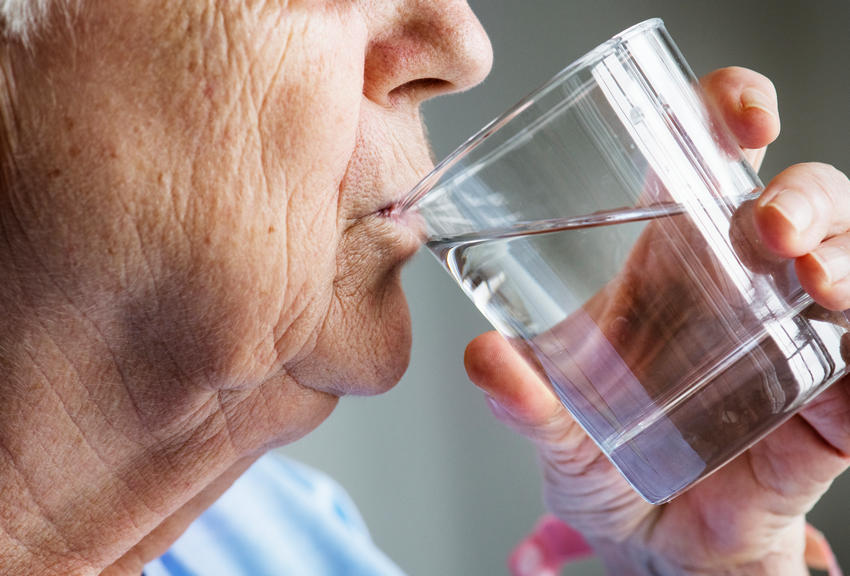 elderly woman drinking water to stop Dehydration